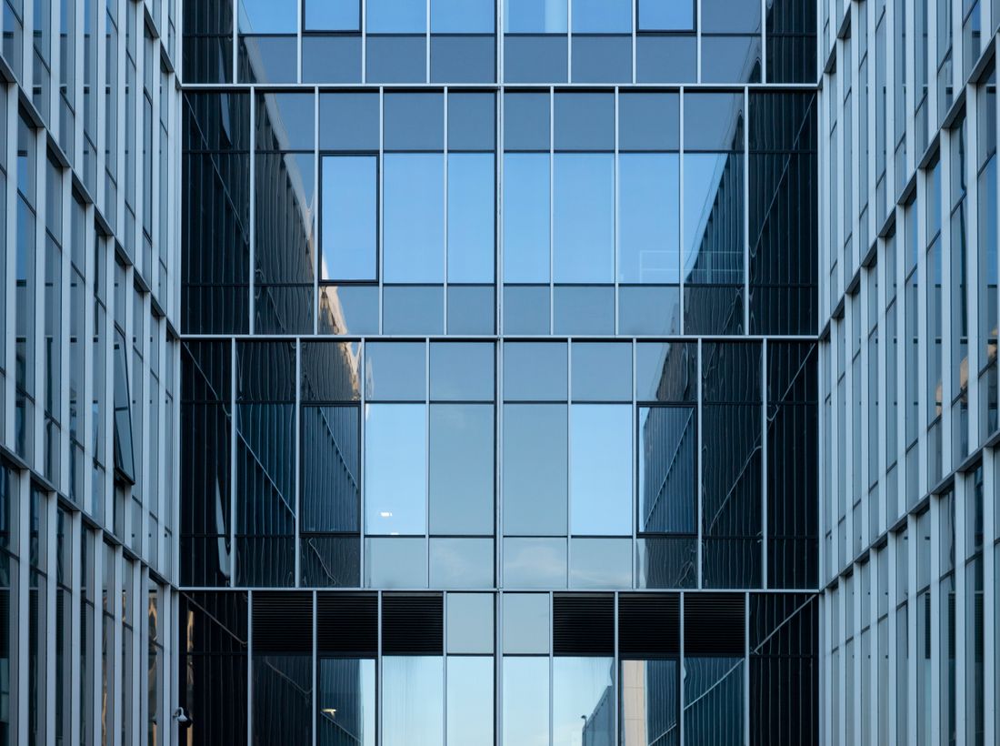 Modern glass commercial building facade in a business district