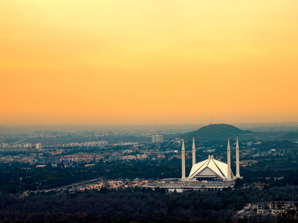 Faisal Mosque and Islamabad skyline at sunset
