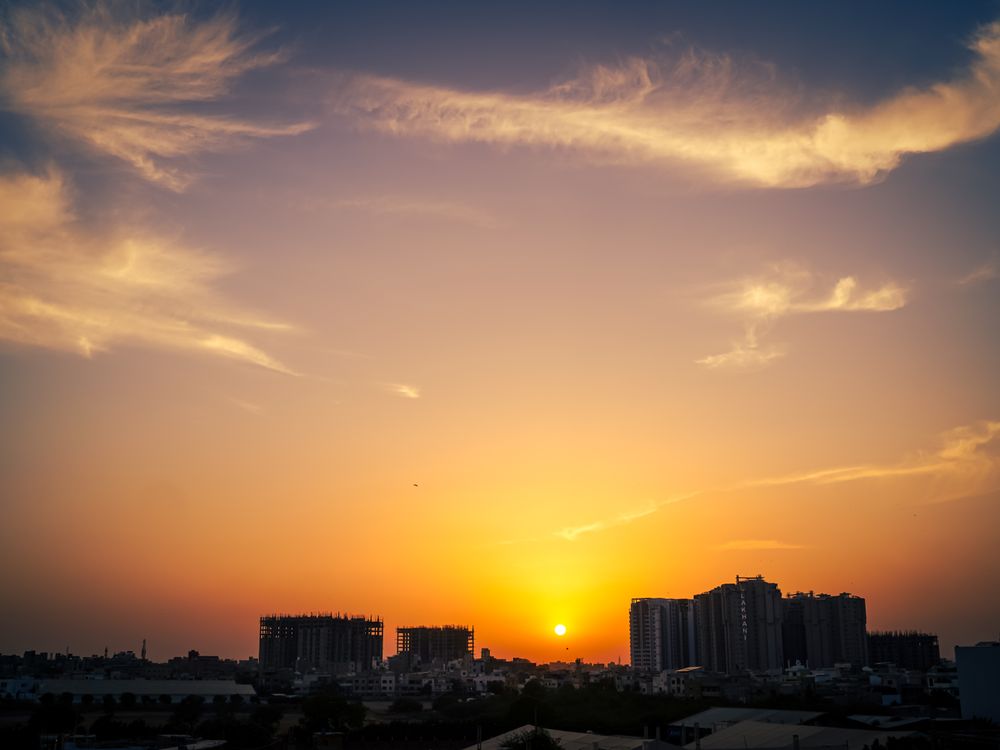 Karachi skyline at sunset with high-rise buildings