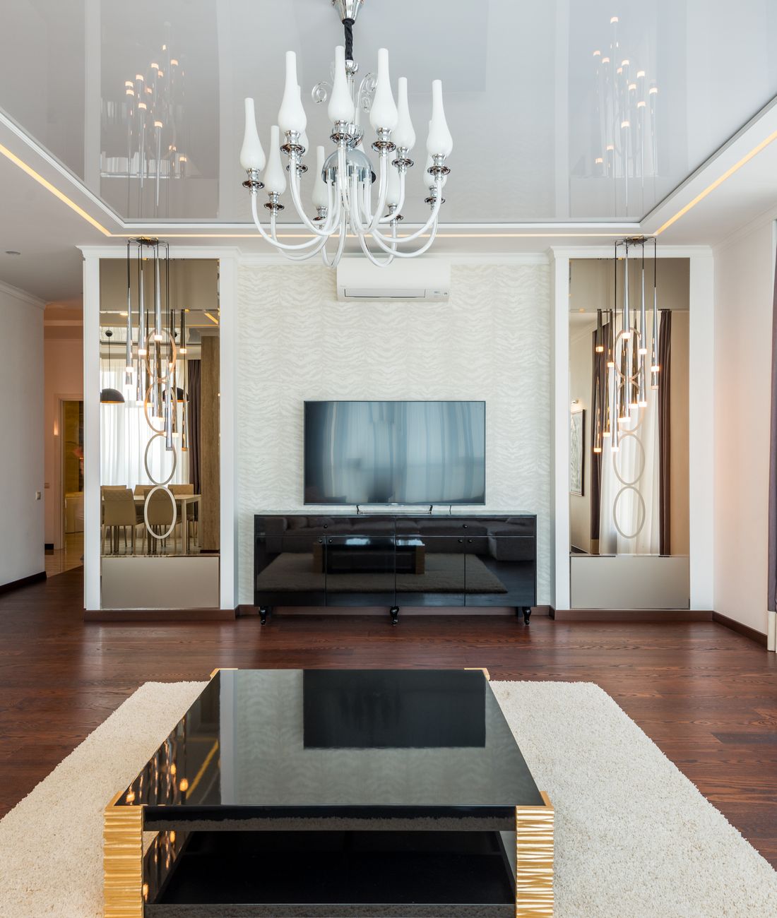 Modern open-plan living space with designer lighting